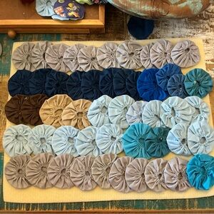 Handmade vintage Fabric Yo-Yo Quilt Pieces, total of 50!